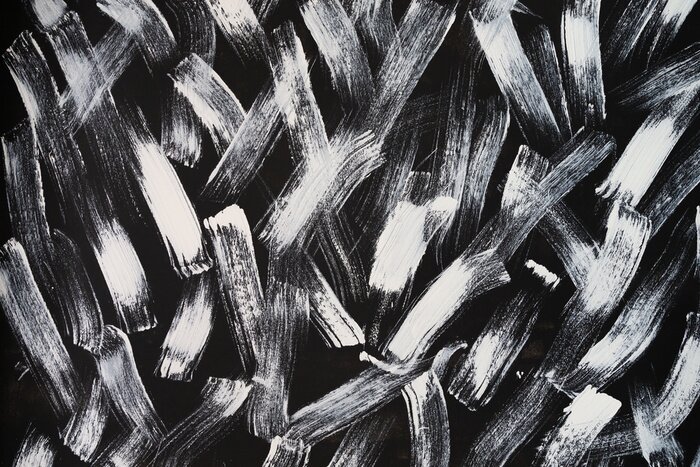 Bild abstract wallpaper painted by white brush on black background texture.