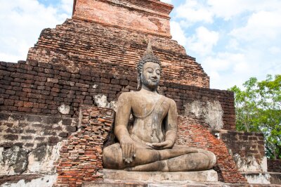 Bild Asien Buddha auf Backsteinmauer