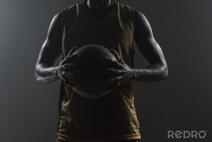 Bild Baskettballspieler auf dunklem Hintergrund