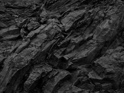 Bild Black rock background. Dark gray stone texture. Black grunge background. Mountain close-up. Distressed backdrop.