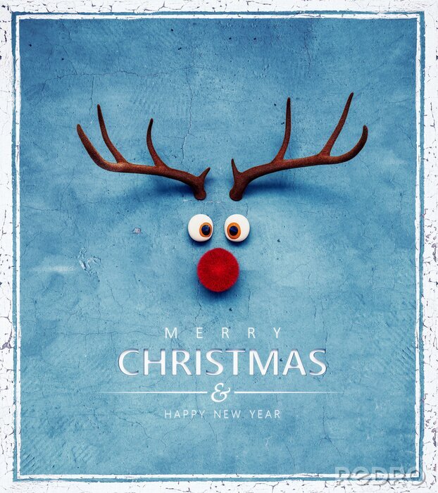 Bild Christmas Reindeer with red cold nose on blue background 3D Rendering