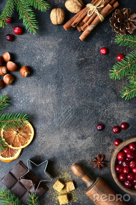 Bild Culinary background with christmas winter spices and ingredients for baking. Top view with copy space.