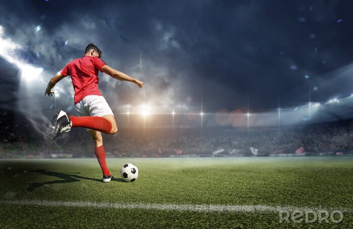 Bild Ein Fußballer beim Fußballspielen