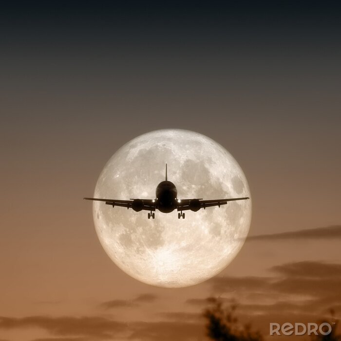 Bild Flugzeug mit Mond im Hintergrund