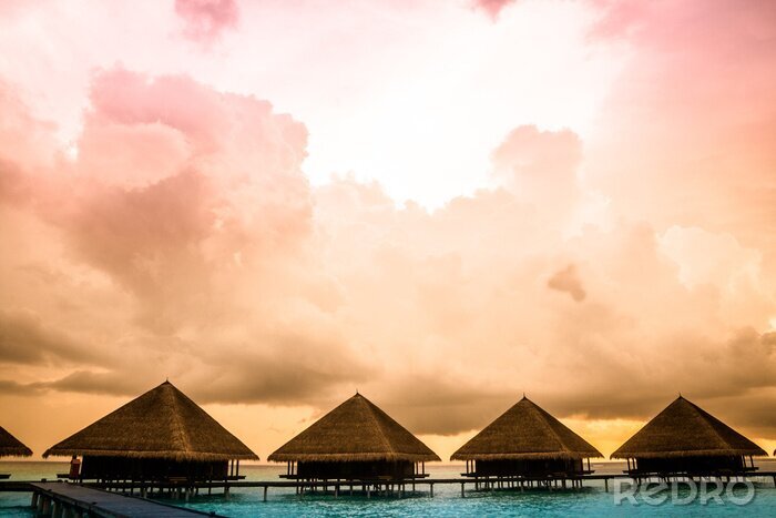 Bild Holzhütten an azurblauer Lagüne