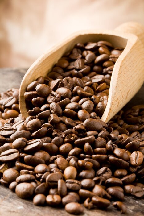 Bild Kleine Kaffeebohnen und Holzlöffel