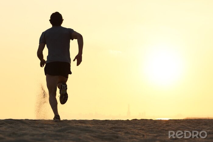 Bild Laufender Mensch beim Sonnenuntergang