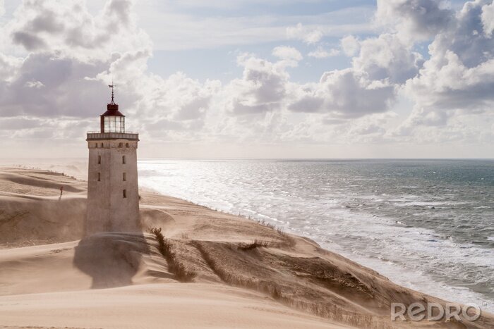 Bild Leuchtturm auf Sand stehend