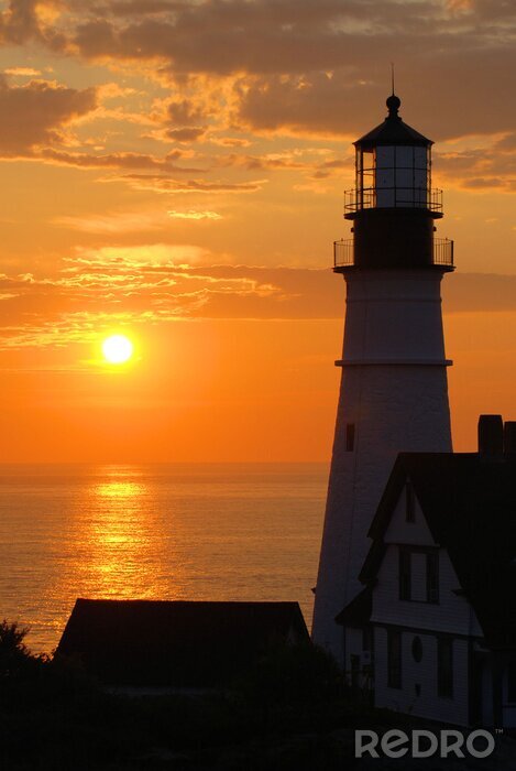 Bild Leuchtturm und untergehende Sonne