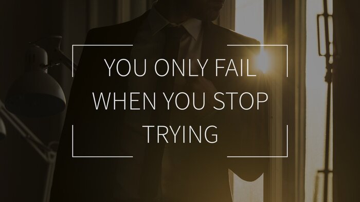 Bild Motivierende Aufschrift vor dem Hintergrund des Mannes im Anzug