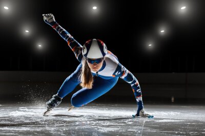 Bild Professionelle Schlittschuhläuferin auf Eis