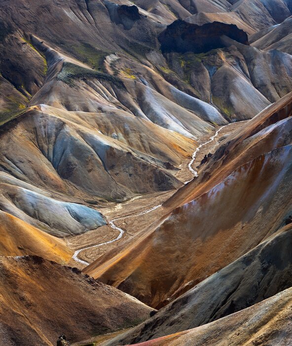 Bild River along a Valley in Landmannalaugar among colorful mountains, Iceland