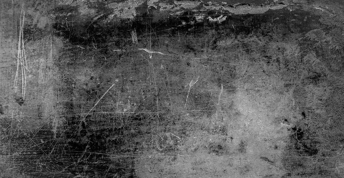 Bild Schwarz-weiße Betonwand mit Rissen