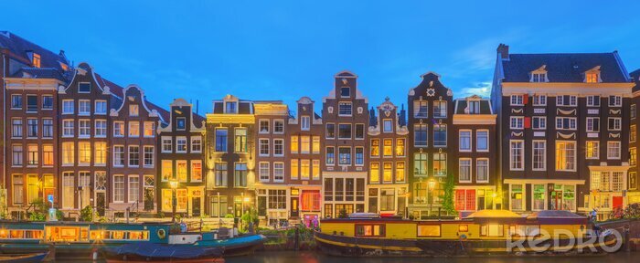 Fototapete Amsterdam bei Nacht mit beleuchteten Gebäuden