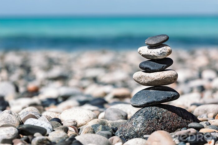 Fototapete Angeordnete Steine vor dem Hintergrund des Meeres