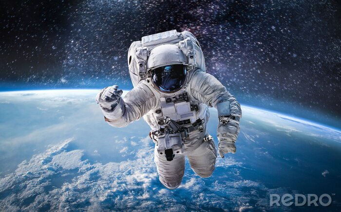 Fototapete Astronaut über dem Planeten Erde
