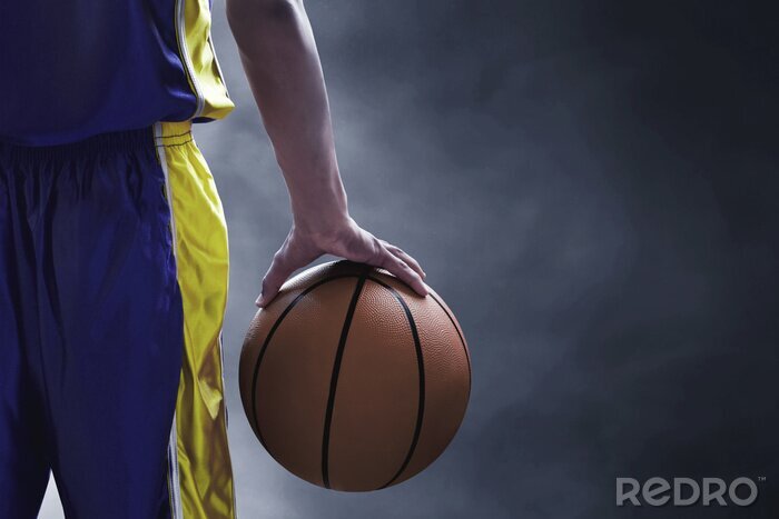 Fototapete Basketball Ball in der Hand eines Spielers