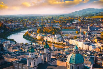 Fototapete Beautiful of Aerial panoramic view in a Autumn season at a historic city of Salzburg with Salzach river in beautiful golden evening light sky and colorful of autumn at sunset, Salzburger Land, Austria