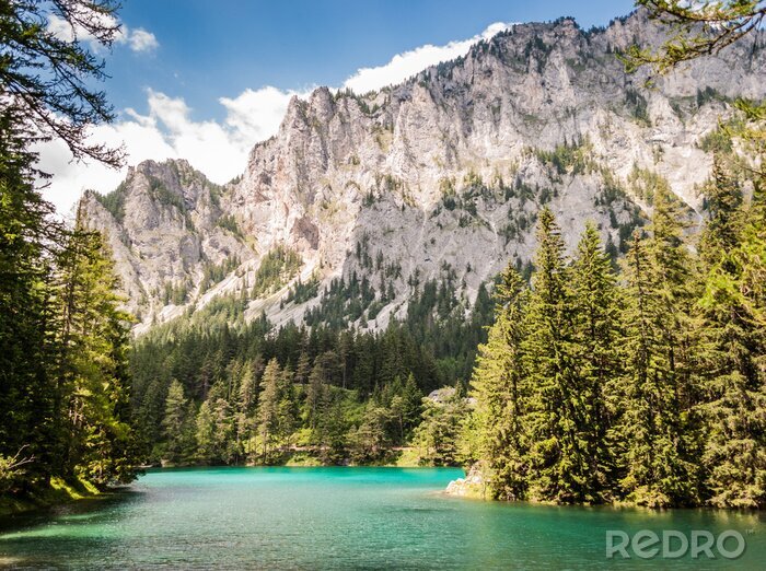 Fototapete Berge und türkisfarbenes Wasser im See