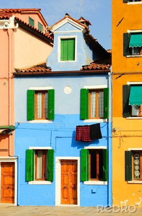 Fototapete Blaues Haus mit grünen Fensterläden