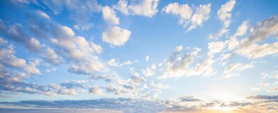 Fototapete Blue sky clouds background. Beautiful landscape with clouds and orange sun on sky