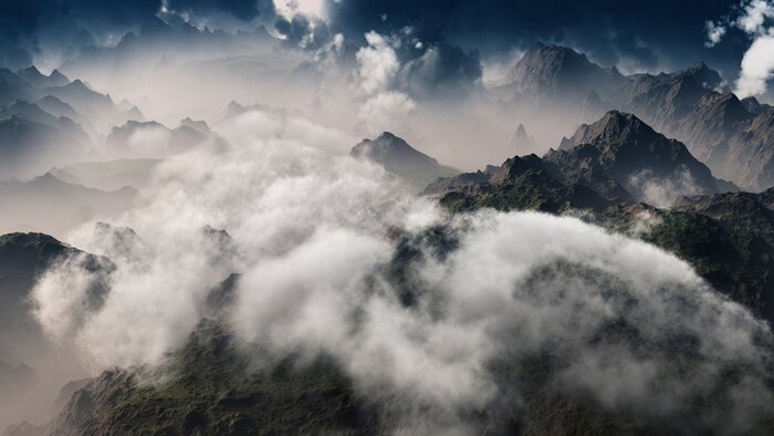 Fototapete Clouds over mountain range. Aerial view.