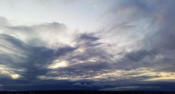 Fototapete Dark clouds in the evening - cloudy sunset