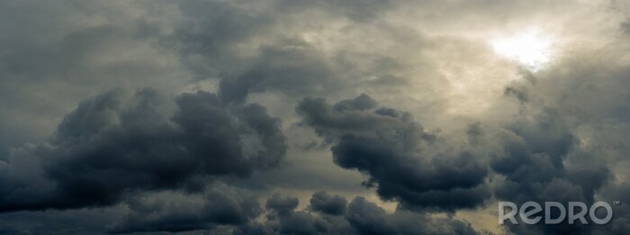 Fototapete Die Sonne bricht durch die Wolken