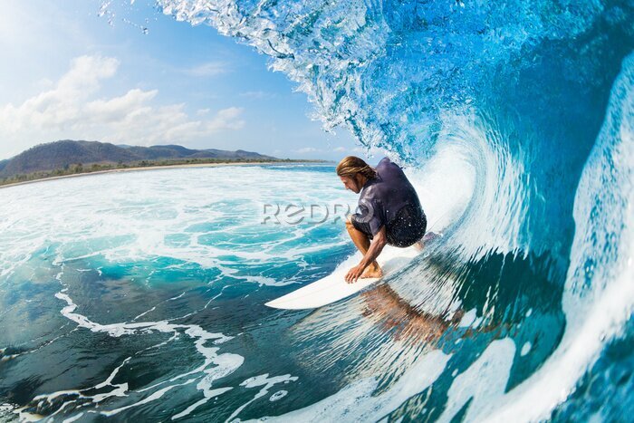Fototapete Ein Surfer auf einer blauen Welle