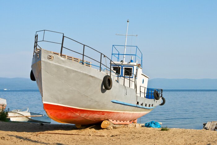 Fototapete Fischerboot am Strand