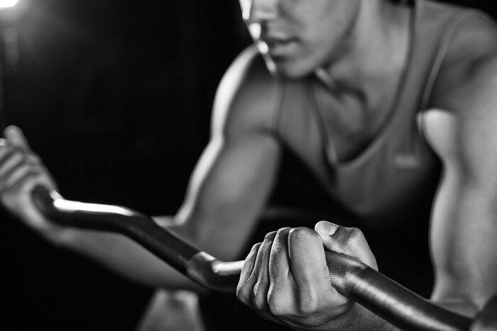 Fototapete Fitness zu Hause mit Langhantel