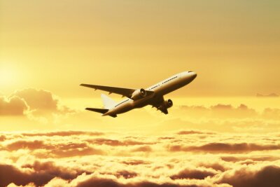 Fototapete Flugzeug im Himmel bei Sonnenuntergang