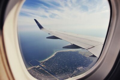 Fototapete Flugzeugfenster auf meer