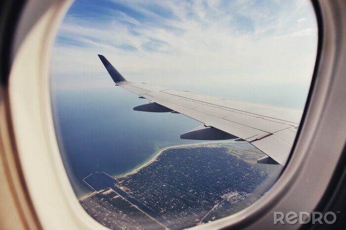 Fototapete Flugzeugfenster auf meer