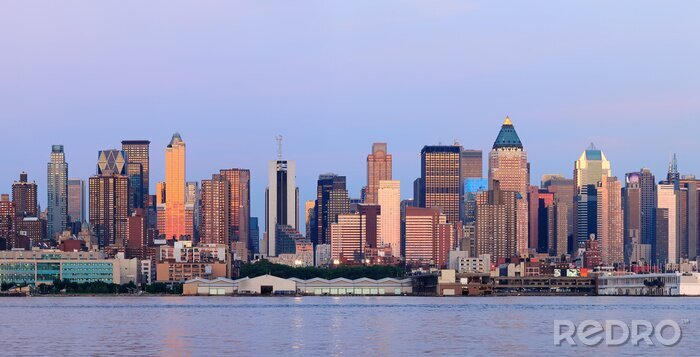 Fototapete Gebäude von New York City bei Sonnenuntergang