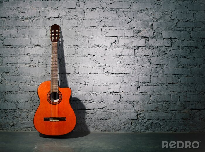 Fototapete Gitarre bei grauer Mauer