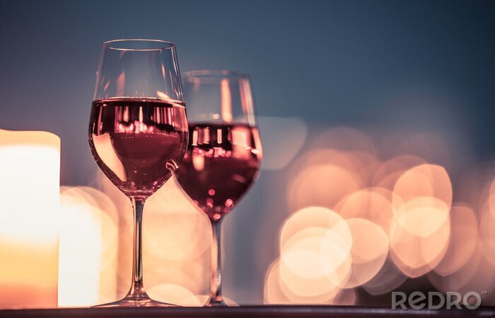 Fototapete Gläser Wein und Kerzenlicht