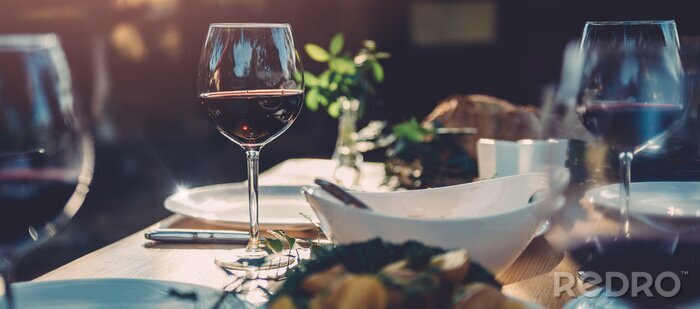 Fototapete Glas Wein und Essen
