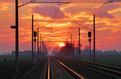 Fototapete Gleise ohne Züge bei Sonnenuntergang