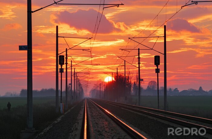 Fototapete Gleise ohne Züge bei Sonnenuntergang