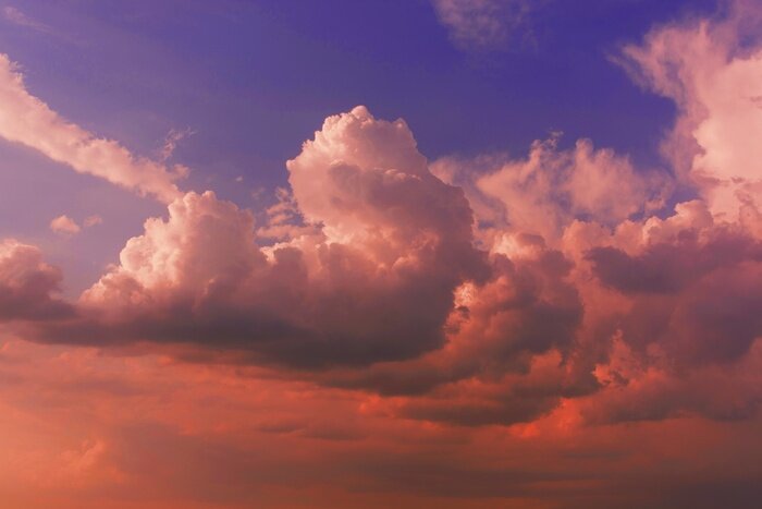 Fototapete Große Wolken bei Sonnenuntergang