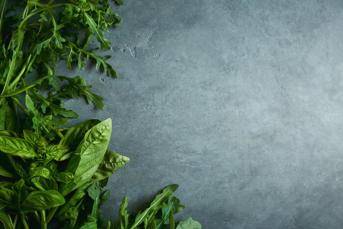 Fototapete Grüne Kräuter auf der grauen Arbeitsplatte