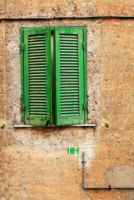 Fototapete Grünes fenster auf steinhaus