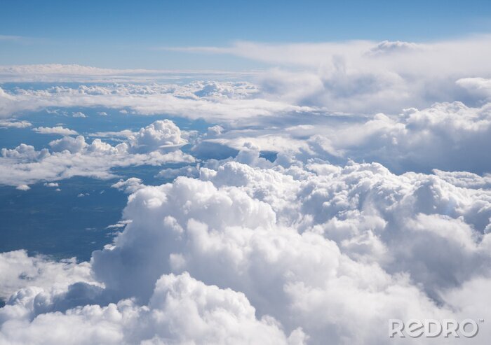 Fototapete Haufenwolken über dem Boden