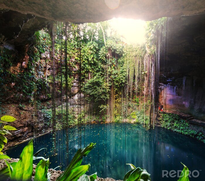Fototapete Höhle mit türkisfarbenem Wasser