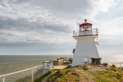 Fototapete Hölzerner Leuchtturm am Meer