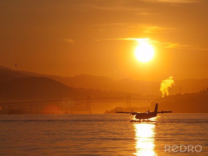 Fototapete Landschaft mit Flugzeug auf Wasser