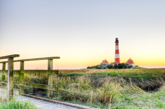 Fototapete Leuchtturm bei Sonnenuntergang
