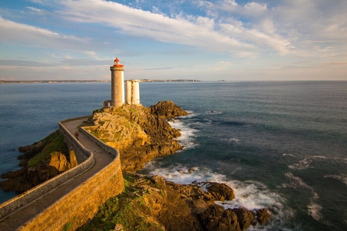 Fototapete Leuchtturm in Sonnenstrahlen