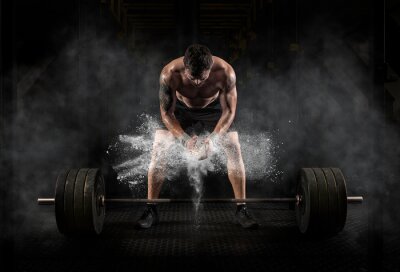 Fototapete Mann bereitet sich auf das Training vor